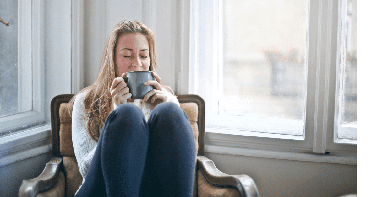 Woman taking a moment to relax and enjoy a cup of coffee