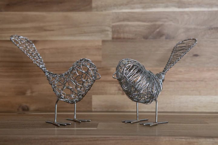 2 love birds made out of antique wire.