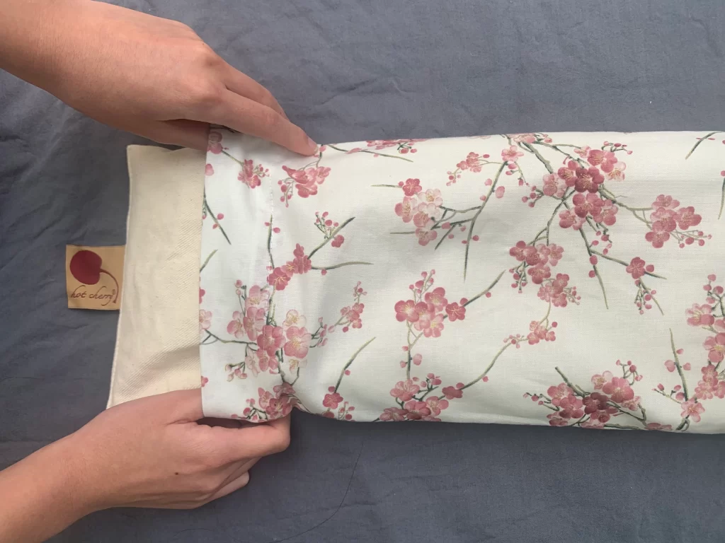 Cervical hot cherry  pillows with cherry blossom pillow case.