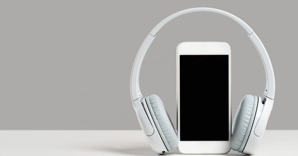headphones and a phone for Audible books