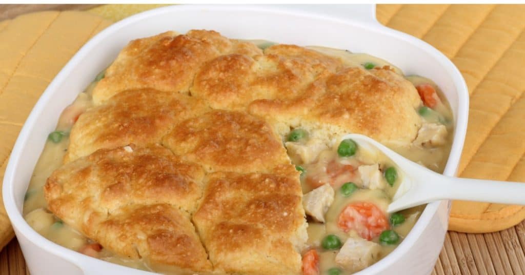 Homemade chicken pot pie in a corningware dish.