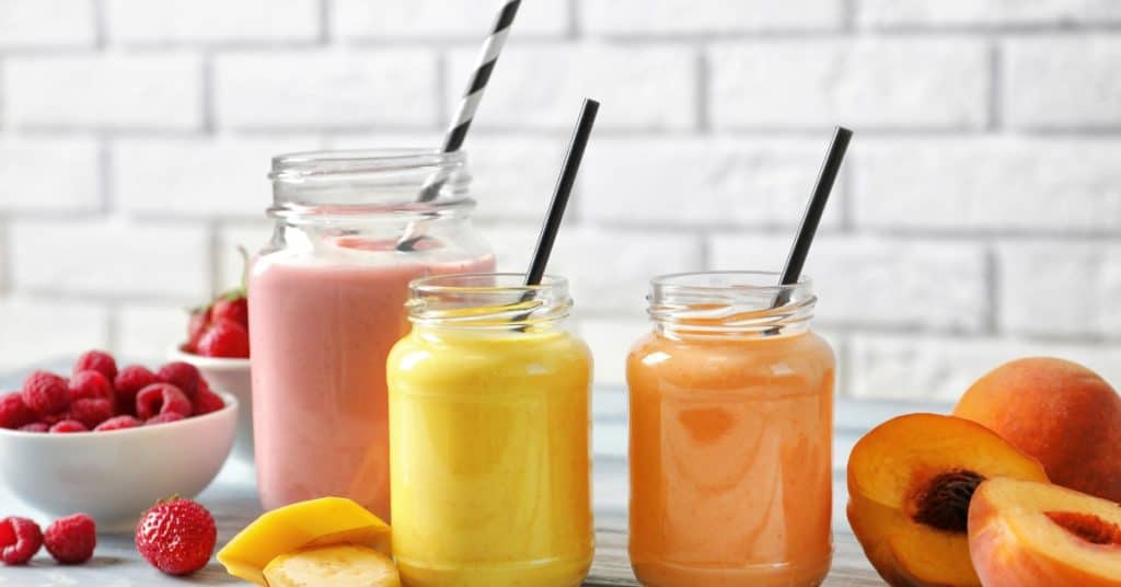 3 colorful fruit smoothies (red, orange and yellow)